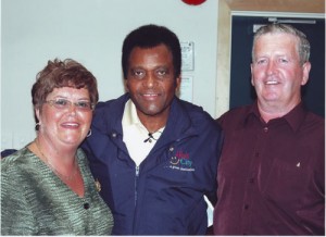 Susan Butler with Charlie Pride, one of the many famous performers she has brought to Miramichi.